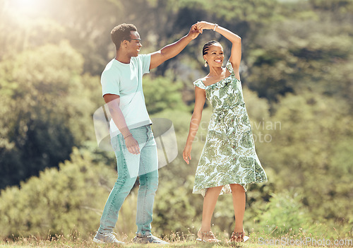 Image of Love, freedom and celebration by couple dancing outdoors, loving romantic getaway and bonding. Happy black man and woman being playful and sweet, enjoying their relationship and having fun together