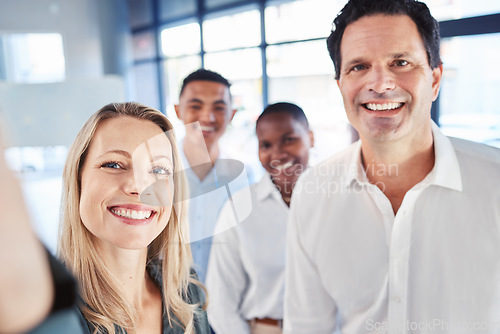 Image of Partnership, diversity and a business team take a selfie in office after startup launch. Teamwork, confidence and support, happy to be working together. Proud corporate men and woman smile for photo