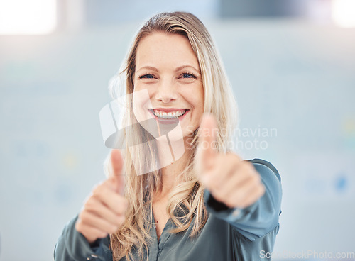 Image of Thumbs up, motivation or yes and a happy business woman with a smile in the office. Thank you, success and winner with a female employee in celebration of an agreement, support or goal at work