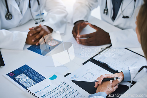 Image of Paperwork, meeting and team of doctors consulting about medical treatment, medicine and surgery. Group of healthcare staff discussing patient results and documents in the hospital conference room.