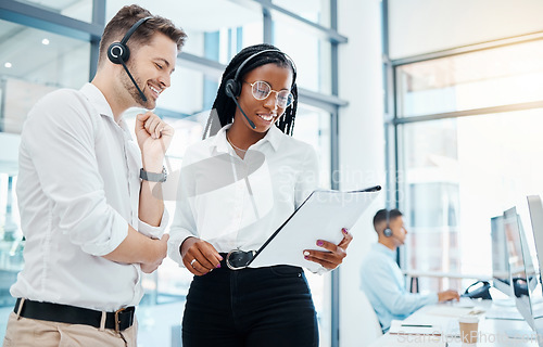 Image of Call center, telemarketing and about us CRM consultants reading faq and qa training manual in a modern office. Collaboration, teamwork and diversity with man and woman at a customer support agency