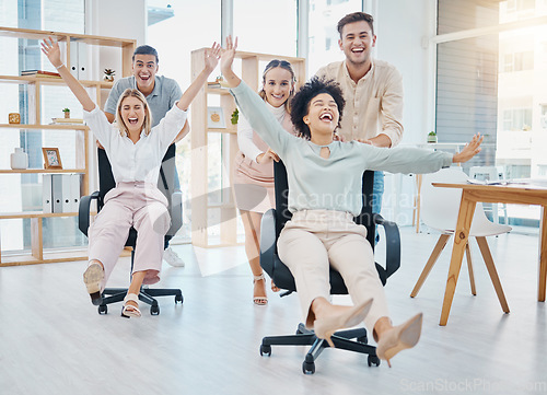 Image of Happy business people doing office games with chair at work, celebration of success and freedom at startup company and crazy teamwork at job. Comic, smile and funny team doing teambuilding together