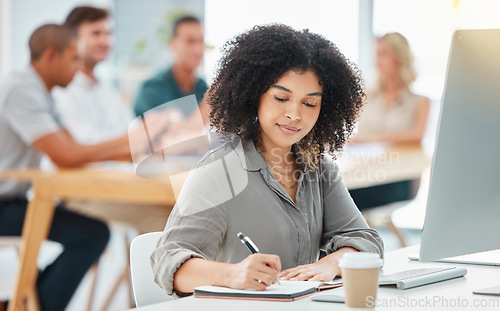 Image of Business woman writing marketing strategy in notebook, doing checklist for startup and working in an office at work. Black employee, manager and corporate worker planning a creative idea