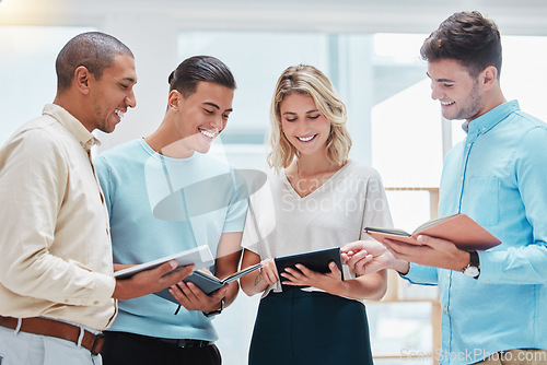 Image of Journalist team collaboration in an office sharing notes and stories and planning strategy together at the workplace. Happy and excited business reporters working on a report for corporate news