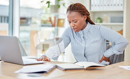 Image of Business black woman, back pain and health stress, risk and muscle injury at modern office workplace desk job. Young african american, uncomfortable spine problem and bad sitting posture for working