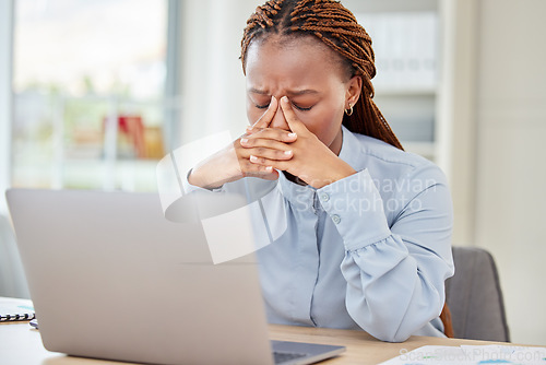 Image of Black woman, headache and working at desk with pain and tension in head with glitch mistake on pc. Corporate girl with stress, fatigue and frustrated feelings after receiving bad news.