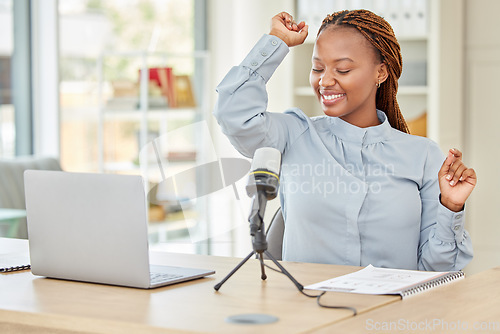 Image of Podcaster, presenter or blogger dancing and having fun to music while recording a podcast talking over a microphone for her talk show. Funny radio host using audio equipment doing a live broadcast