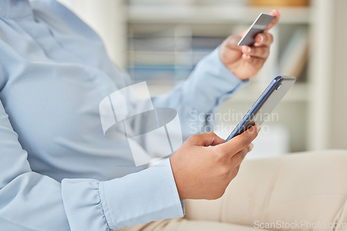 Image of Business woman online shopping with a credit card and phone while on a break in corporate office. Closeup of a girl paying her mortgage, debt or financial bills with internet banking on a smartphone.