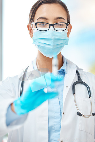 Image of Covid vaccine, doctor with face mask and healthcare at hospital with nurse, medical injection for virus and help from expert at clinic. Portrait of worker in medicine helping with health at work