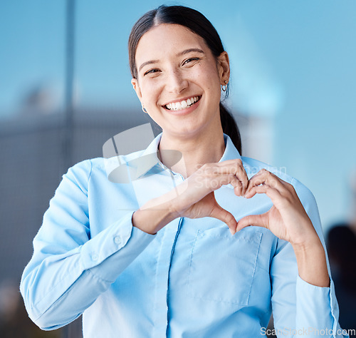 Image of Hands, heart sign and business woman with smile, affection or love emoji. Portrait of happy corporate female, romance or hand symbol or emotion shape, intimacy or adoration, support or affection.