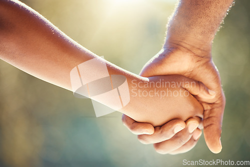 Image of Trust, family and adoption with father and child holding hands while walking together outside. Parent and kid showing security, care and love with man and boy sharing a safe and special bond