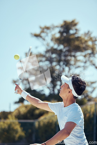 Image of Professional tennis player man, fitness athlete and sports playing match, action and game with racket outdoors. Competitive, motivation and young focus guy serve, hit and practice healthy training