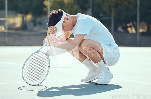 Image of Tennis mistake, man focus and pray position of a athlete from China sad about sport match results. Fitness, training and sports workout of a strong Asian competitive player praying on exercise court