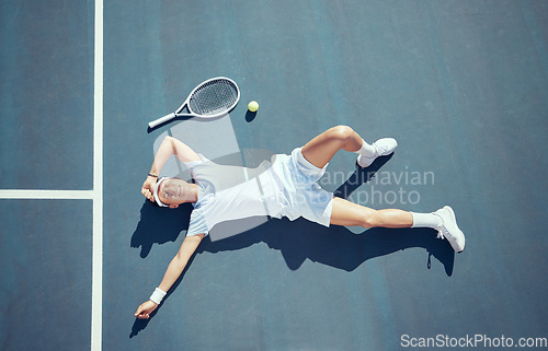 Image of Tired tennis player, sports burnout and game fatigue on court sport training, muscle injury from exercise on ground and sad about mistake. Depressed and Asian athlete upset about competition loss