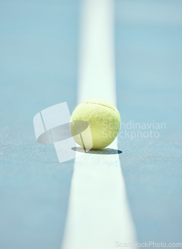 Image of Tennis ball on the floor of a sports court during practice for a match in summer outdoors. Closeup of equipment for athlete team to train their strategy and skill for exercise and a game at stadium.