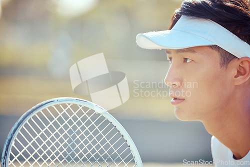 Image of Tennis, sports and exercise focus of a Asian man athlete in a sport, training or fitness game. Player from Japan with a competitive mindset feeling healthy, strong and ready to start a workout match