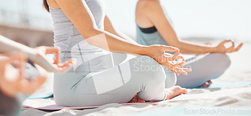 Image of Women meditation in lotus with zen yoga class at the beach. Group of wellness female together on mat, leg crossed, finding inner mental balance and peace. Practice calming breathing exercise