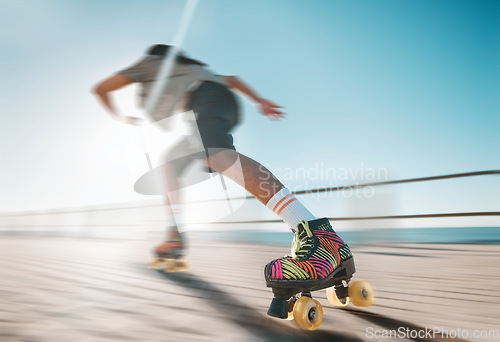 Image of Freedom, speed and fitness, a woman on roller skates in the sun. Summer sports, retro exercise and a girl skating as a workout. Action, motion and sunshine, a professional skater going fast on a path