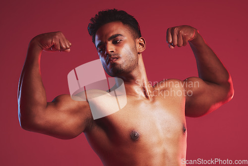 Image of Fitness health, strong muscles and sports man with healthy body against red mockup studio background. Mock up of thinking, sport and Indian professional bodybuilder and weightlifter flexing muscle