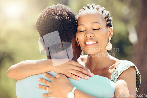 Image of Love, relax and happy couple hug in nature for a save the date wedding announcement. Young man and woman happiness from Jamaica in the summer sunshine to show romance, trust and romantic partnership