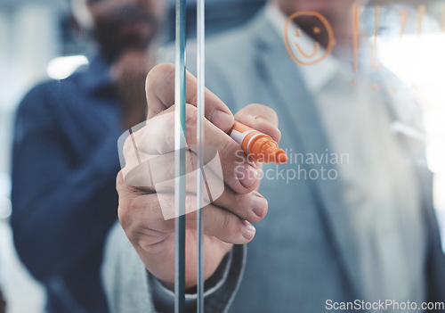 Image of Project manager hand planning a strategy or writing notes on a glass. Businessman brainstorming and thinking of ideas in his presentation. Corporate male entrepreneur being innovative in an office