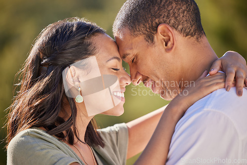 Image of Happy, forehead and couple with love smile, bond and relax in romantic nature park date. Peace, freedom and beauty for man and woman on getaway to a green Spring forest, woods or outdoor adventure