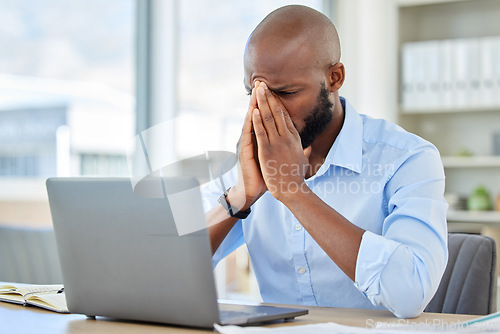 Image of Stress, anxiety and tired businessman with a laptop suffering from burnout while frustrated, fail and mistake in the office. Entrepreneur suffering from headache with a deadline working at a desk