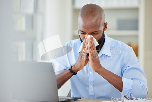 Image of Covid, flu and healthcare virus for black businessman with laptop in office, company or creative startup. Medical burnout, allergy or sick worker, desk employee or entrepreneur blowing nose on tissue