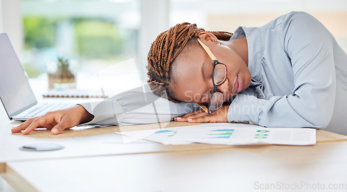 Image of Sleeping, tired or burnout black woman in finance office with desk laptop or infographic documents. Exhausted, overworked or depression for accounting compliance employee in financial audit business