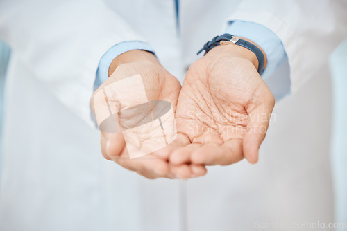 Image of Charity, empty hands and asking donation for a medical procedure, surgery and healthcare by doctor. Health professional holding mockup medical object for copy space, advertising and marketing