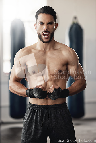 Image of Boxing, strong and boxer man portrait in training workout or fitness gym. Muscle strength, body goals and determined personal trainer athlete during his exercise for healthy motivation or mma sports