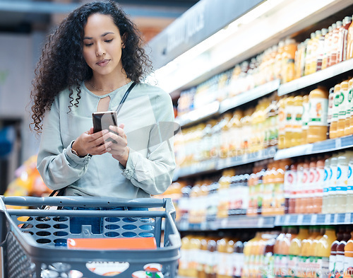 Image of Supermarket, phone and woman shopping, search and on internet for grocery store product, drink or juice. Customer on 5g technology fintech app for buying healthy or wellness food in inflation economy