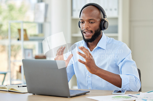 Image of Black man, laptop and call center employee talking, training and in customer service, help and contact us support. Crm consulting office worker, receptionist or telemarketing communication consultant