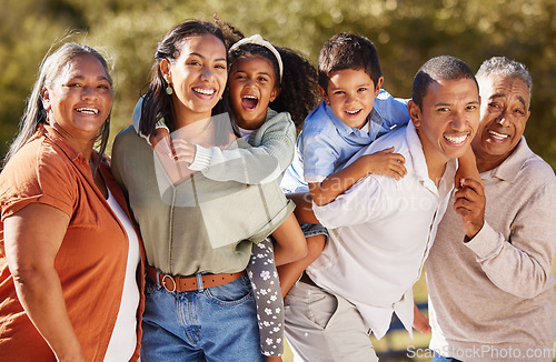 Image of Big family, three generation and happy people sharing love, care and a special bond while at the park on a sunny day. Portrait of children, parents and grandparents out on a fun adventure in mexico