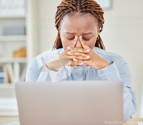 Image of Stress, anxiety and headache by business woman working on laptop in a corporate office, suffering from pain and discomfort. Worried entrepreneur looking ill, feeling stressed and burnout at workplace