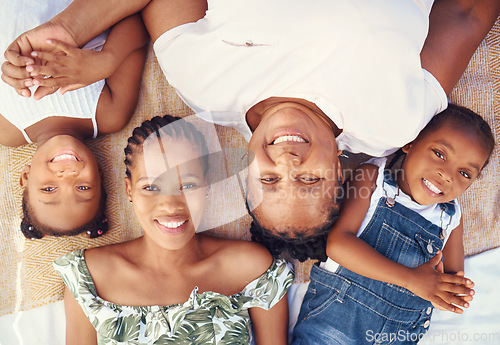 Image of Black family portrait with mother, grandma and children relax for summer vacation, holiday or happy break in sunshine. Big family and kids face smile together lying on ground at beach from above