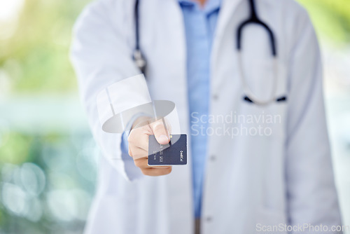 Image of Medical credit card, insurance and doctor hand in financial support, trust and paperless payment with bokeh. Professional healthcare worker and finance solution clinic, pharmacy or hospital purchase