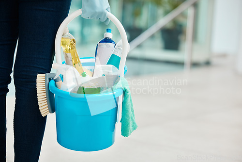 Image of Cleaning container products with cleaner person hand in a office building or corporate business. Service worker scrub, gloves and liquid soap for disinfectant, sanitize and hygiene in the workplace