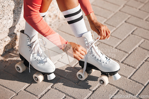 Image of Roller skate shoes, woman tying laces and fun summer fitness activity, holiday workout and urban lifestyle outdoor. Gen z, girl and youth ready to start skating, travel and healthy wellness exercise