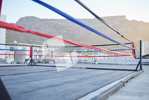 Image of Outdoor, sports and empty boxing ring in the city for a wrestling competition for athletes or boxers. Outside martial art corner in the street for fitness, workout and exercise fights in south africa