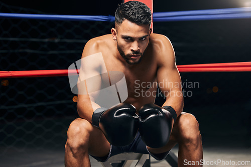 Image of Boxing ring man, strong power and focus mma fighter ready to punch, hit and challenge competition champion in gym club, exercise and training. Fitness portrait, boxer gloves impact and sports athlete