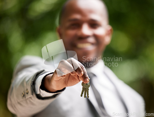 Image of Real estate agent keys, man portrait and new house property for sale, lease and rent on home loan, building mortgage and sales finance. Zoom hands of realtor, broker and homeowner moving deal outdoor