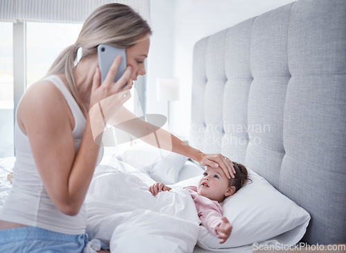Image of Phone call, sick and child in bed with mother feeling for fever with hand on forehead with worry, care and love. .Family, medical and stress with mom checking health on baby girls head for virus