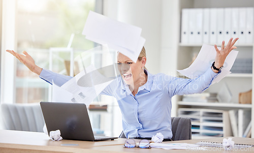 Image of Woman, laptop and stress with flying paper, anxiety and burnout with 404 technology glitch in a business office. Angry, frustrated worker and shouting employee with target audience research documents