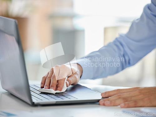 Image of Businessman, laptop and covid sanitizer wipe for cleaning keyboard bacteria, virus or stop to global healthcare crisis. Zoom on worker hands, security or employee safety compliance in company office