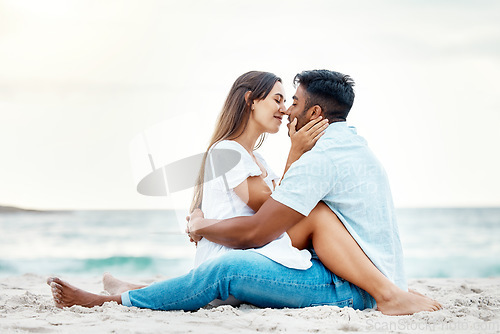 Image of Kiss couple, beach love and happy honeymoon, travel and summer relaxing at seashore together. Romantic man, smile woman and young people on ocean vacation, intimate holiday and quality time date