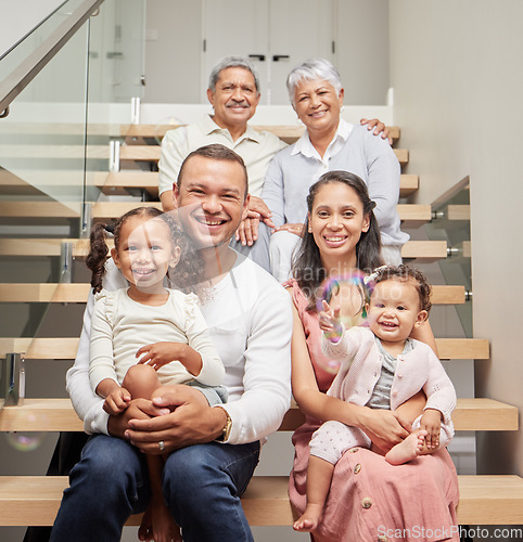 Image of Big family, three generation and happiness of children, parents and grandparents sitting together on stairs in their home while smiling. Bond, support and closeness of kids with man and woman
