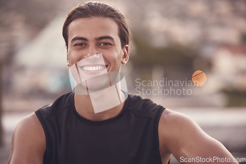 Image of Sport man from Portugal about to start fitness, exercise and training outdoors. Portrait of a happy, strong and healthy smile of a young athlete after a cardio sports workout relax with happiness