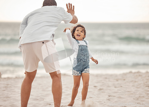 Image of High five, beach and father and daughter bonding near ocean water, having fun and playing in nature. Parent and child good time, enjoying freedom and their bond, happy vacation celebration in Mexico