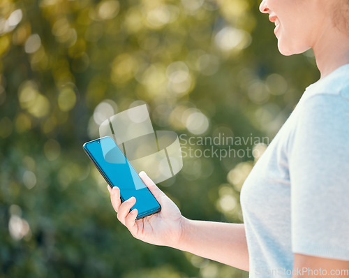 Image of Nature walk for woman with mockup phone for peace of mind, healthy mindset or freedom with blue screen chroma key. Girl with smartphone copy space walking in outdoor park for wellness or exercise